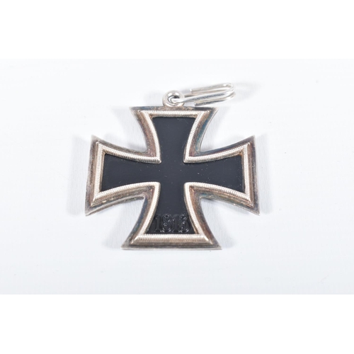 230 - A WW2 GERMAN IRON CROSS WITH EAGLE CLASP AND ANOTHER IRON CROSS MADE BY JUNCKER, both crosses are ma... 