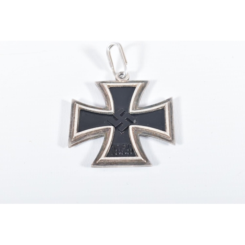 230 - A WW2 GERMAN IRON CROSS WITH EAGLE CLASP AND ANOTHER IRON CROSS MADE BY JUNCKER, both crosses are ma... 