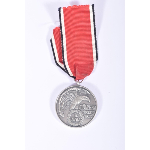 237 - A NSDAP BLOOD ORDER MEDAL AND A 1936 OLYMPIC MEDAL, the blood order is officially known as the Decor... 