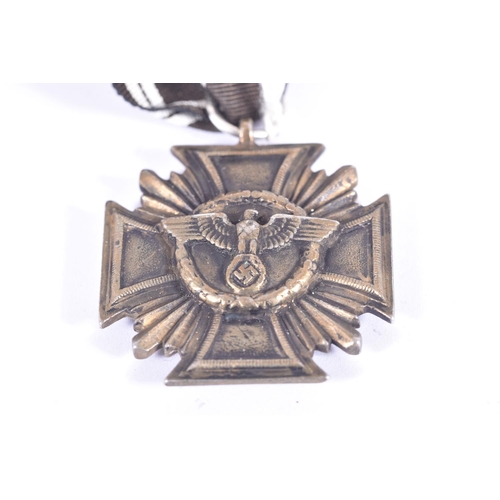 242 - A WW2 NSDAP LONG SERVICE MEDAL, this was awarded for ten years' service in the Nazi party, The Ribbo... 