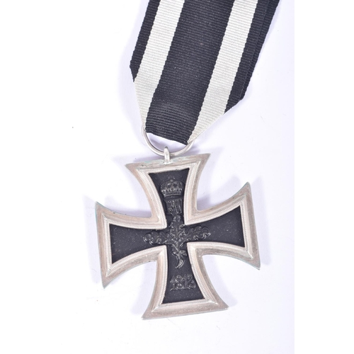 252 - FOUR GERMAN IRON CROSSES, to include a WWI first class iron cross, a 2nd class WWI iron cross and tw... 