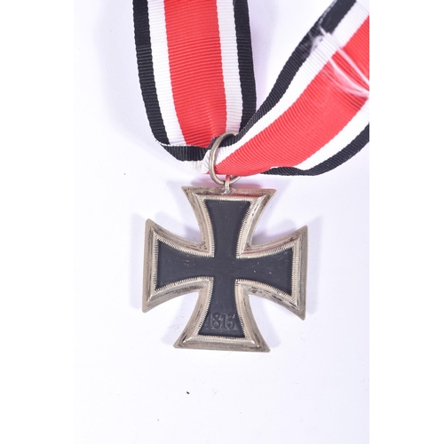 252 - FOUR GERMAN IRON CROSSES, to include a WWI first class iron cross, a 2nd class WWI iron cross and tw... 