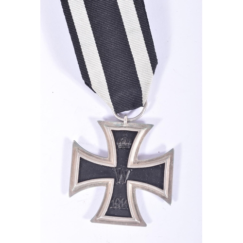 252 - FOUR GERMAN IRON CROSSES, to include a WWI first class iron cross, a 2nd class WWI iron cross and tw... 