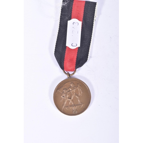 262 - A WWII ERA KNIGHT CROSS WITH SWORDS AND TWO MEDALS, the knight cross appears to be painted over on t... 