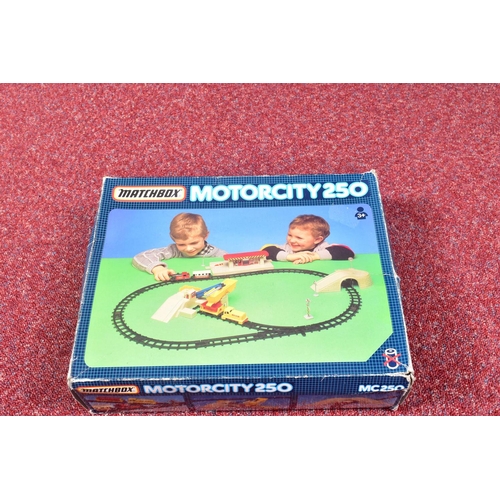 67 - THREE BOXED MATCHBOX MOTORCITY PLAYSETS, Airport, No.MC150, Railway, No.MC250 and Garage Super set, ... 