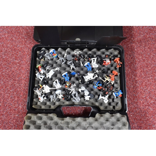 126 - A COLLECTION OF WARHAMMER FIGURES AND PARTS, inside a Wahammer 40,000 Games Workshop plastic shell c... 