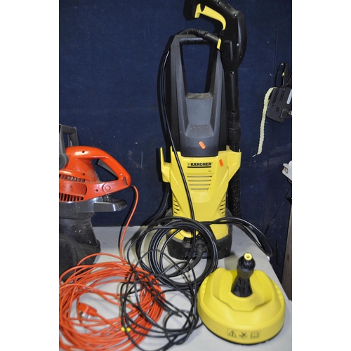 A KARCHER K2 JET WASH with Patio head and a Flymo Gardenvac Plus (both