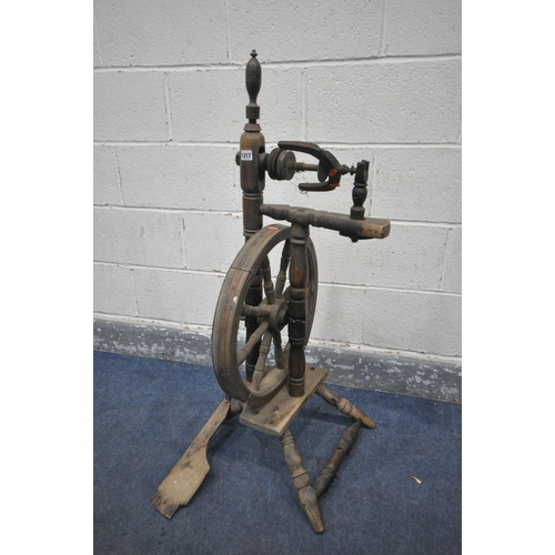 1317 - AN ANTIQUE SPINNING WHEEL (condition:-distressed and ideal for restoration)