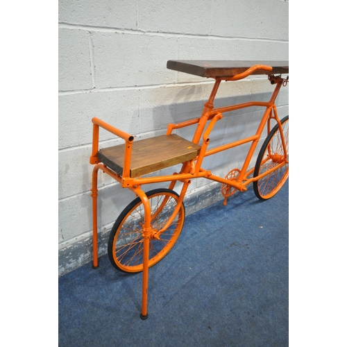 1320 - A CONTEMPORY BESPOKE SIDE TABLE, made from a vintage bicycle, painted in orange, forming of two tier... 