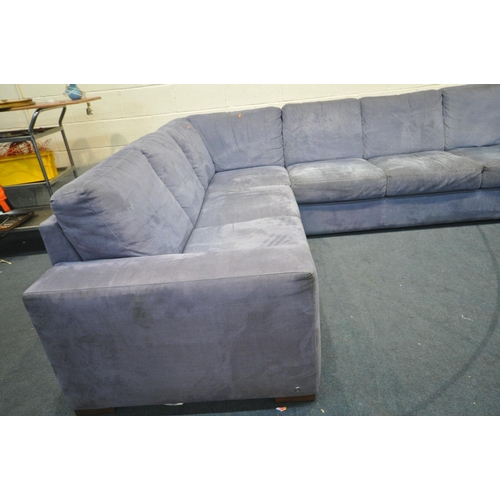 1335 - A NATUZZI BLUE FABRIC CORNER SOFA, length 305cm x 242cm (condition:-fabric dirty and in need of clea... 