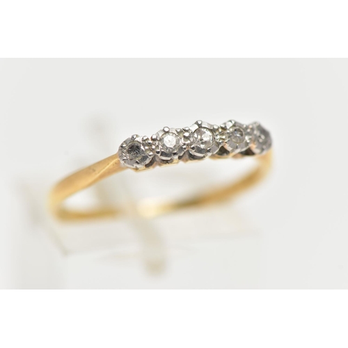 10 - AN EARLY 20TH CENTURY FIVE STONE DIAMOND RING, four single cut diamonds and one old cut diamond set ... 