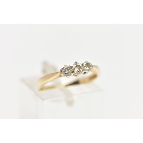 101 - A THREE STONE DIAMOND RING, three round brilliant cut diamonds prong set in yellow gold, approximate... 