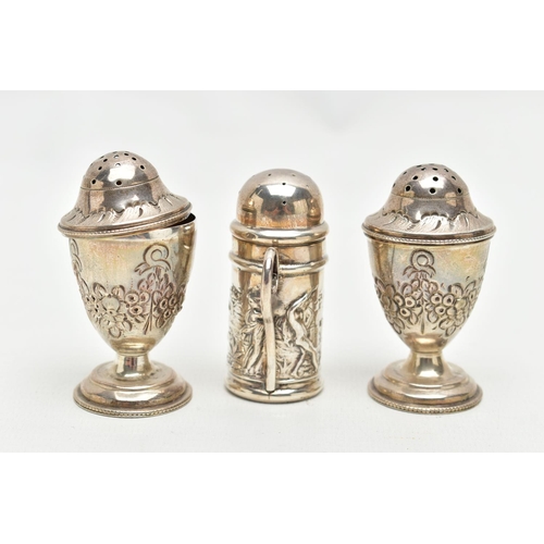 131 - THREE SILVER PEPPERETTES, two matching pepperettes decorated with a floral design, hallmarked 'Georg... 