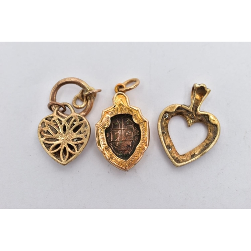 141 - THREE PENDANTS, the first a yellow gold, open work heart pendant, set with single cut diamond detail... 