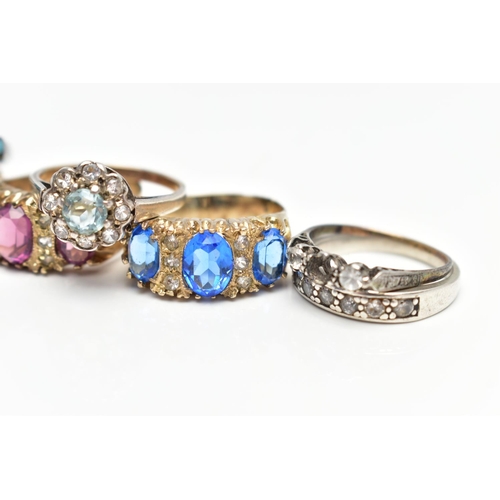 21 - A SELECTION OF SEVEN RINGS, to include a white metal eternity ring, grain set with circular cut cubi... 