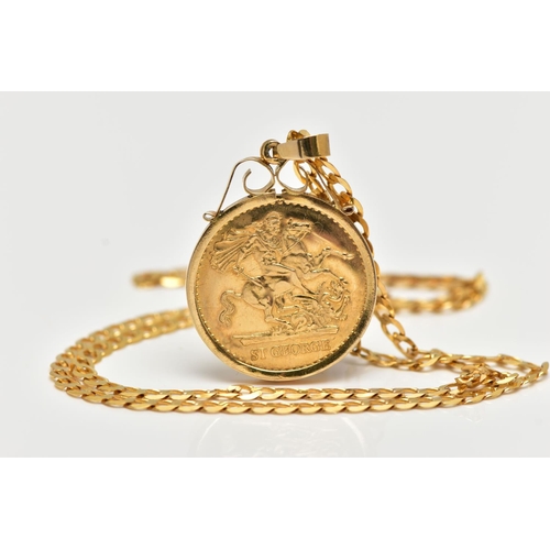 26 - A PENDANT AND 9CT YELLOW GOLD CHAIN, the pendant set with a fake coin, within a plain polished surro... 