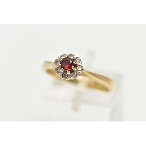 30 - A 9CT GOLD GARNET AND PASTE CLUSTER RING, the principal garnet, within a colourless paste surround, ... 