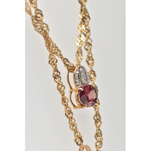 31 - A 9CT YELLOW GOLD SPINEL AND DIAMOND PENDANT WITH CHAIN, the pendant set with a principal purplish r... 