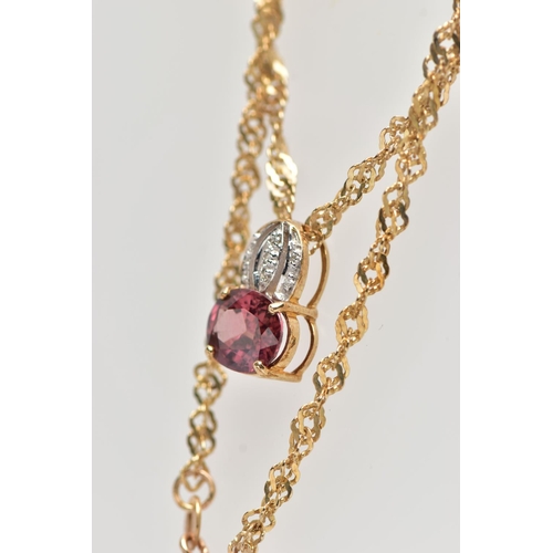 31 - A 9CT YELLOW GOLD SPINEL AND DIAMOND PENDANT WITH CHAIN, the pendant set with a principal purplish r... 