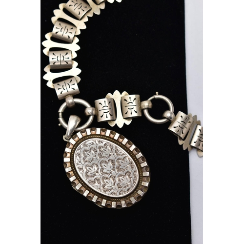 67 - A WHITE METAL BOOK CHAIN WITH LOCKET, designed as a series of rectangular openwork links interspaced... 