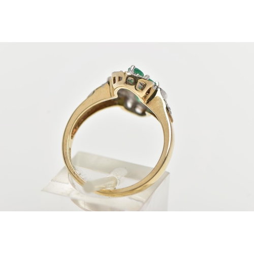 71 - A 9CT YELLOW GOLD, EMERALD AND DIAMOND DRESS RING, of a marquise form, centrally set with four, claw... 