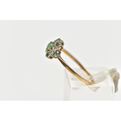 73 - A 9CT YELLOW GOLD, EMERALD AND DIAMOND CLUSTER RING, the cluster of a flower shape, set with a centr... 