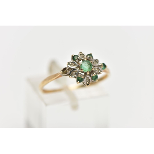 73 - A 9CT YELLOW GOLD, EMERALD AND DIAMOND CLUSTER RING, the cluster of a flower shape, set with a centr... 