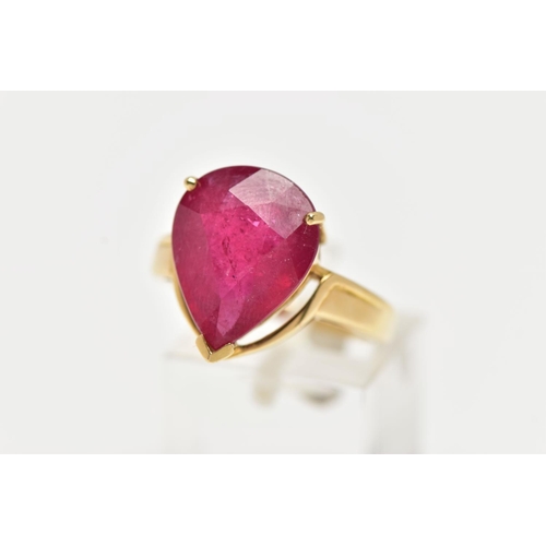 77 - A 18CT GOLD GEM SET RING, a large pear cut glass filled ruby, approximate stone dimensions length 16... 