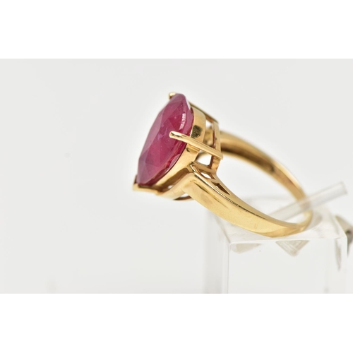 77 - A 18CT GOLD GEM SET RING, a large pear cut glass filled ruby, approximate stone dimensions length 16... 