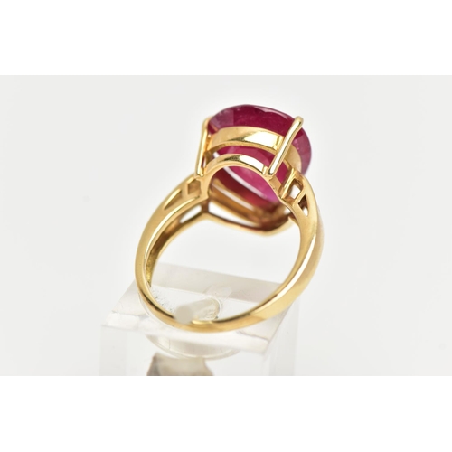 77 - A 18CT GOLD GEM SET RING, a large pear cut glass filled ruby, approximate stone dimensions length 16... 