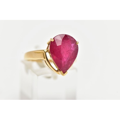 77 - A 18CT GOLD GEM SET RING, a large pear cut glass filled ruby, approximate stone dimensions length 16... 