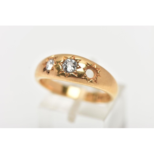 80 - A 18CT GOLD THREE STONE GYPSY RING, a AF yellow gold ring centrally set with a single old cut diamon... 