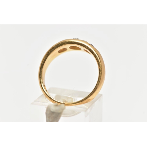 80 - A 18CT GOLD THREE STONE GYPSY RING, a AF yellow gold ring centrally set with a single old cut diamon... 