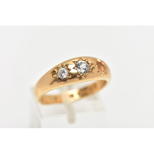 80 - A 18CT GOLD THREE STONE GYPSY RING, a AF yellow gold ring centrally set with a single old cut diamon... 