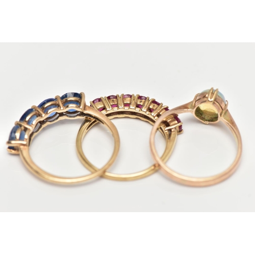 84 - THREE GEM SET RINGS, the first a four stone topaz ring set in yellow gold, hallmarked 9ct Birmingham... 