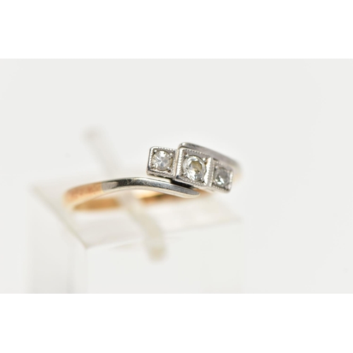 85 - A THREE STONE DIAMOND RING, a central round brilliant cut with two single cut diamonds either side, ... 