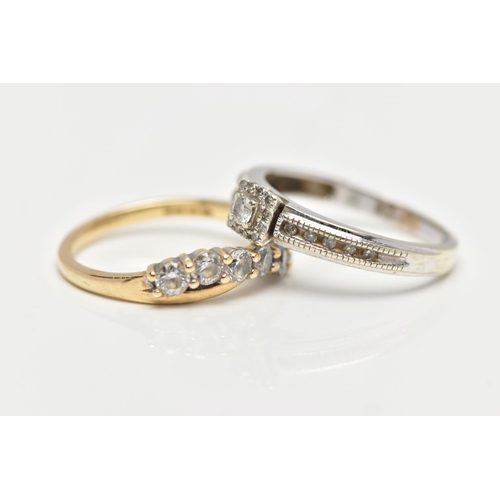 86 - TWO DRESS RINGS, the first a round brilliant diamond set within a square halo of round brilliant cut... 