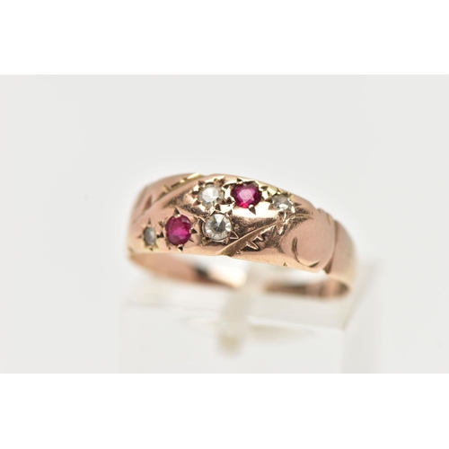 92 - A 9CT GOLD EDWARDIAN RING, four single cut diamonds and two circular cut rubies set within a rose go... 