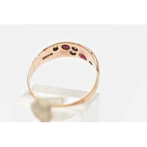 92 - A 9CT GOLD EDWARDIAN RING, four single cut diamonds and two circular cut rubies set within a rose go... 