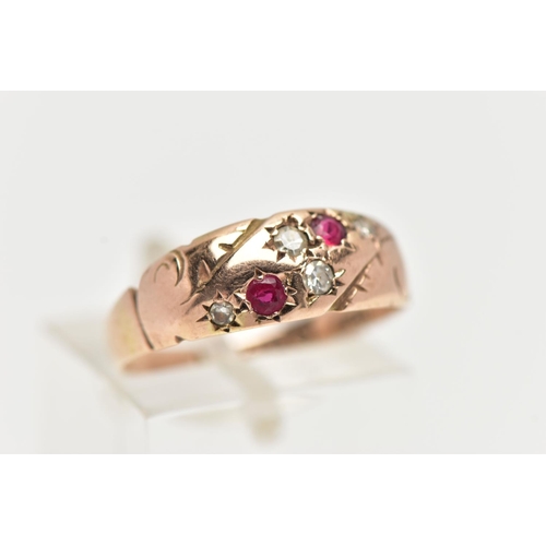 92 - A 9CT GOLD EDWARDIAN RING, four single cut diamonds and two circular cut rubies set within a rose go... 