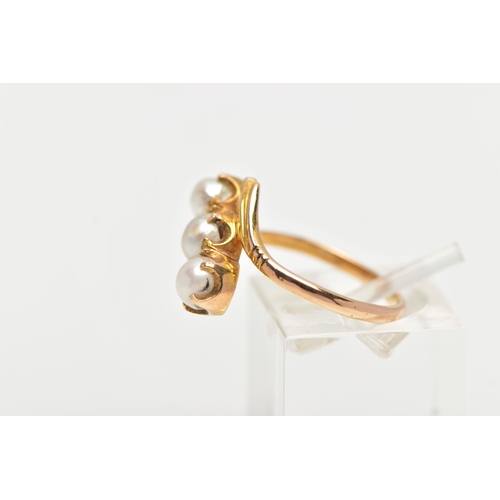 96 - A CULTURED PEARL RING, three cultured white pearls with a silver hue, prong set in a twisted mount d... 