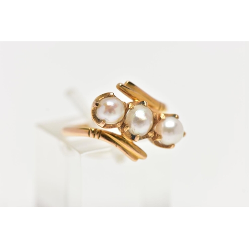 96 - A CULTURED PEARL RING, three cultured white pearls with a silver hue, prong set in a twisted mount d... 