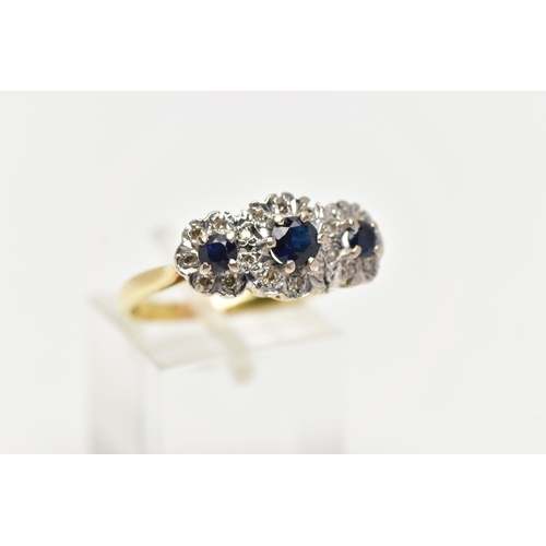 97 - A SAPPHIRE AND DIAMOND RING, three circular cut blue sapphires, set with a surround of single cut di... 