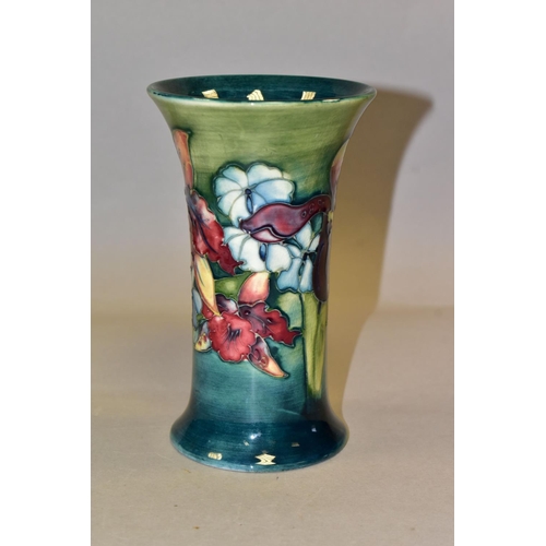 329 - A MOORCROFT POTTERY 'ORCHID' PATTERN VASE, of cylindrical tapering form, tube lined with purple and ... 