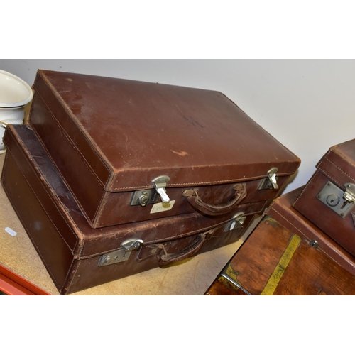 339 - A COLLECTION OF FIVE BROWN VINTAGE SUITCASES AND A WOODEN WRITING SLOPE, comprising five 1950's brow... 