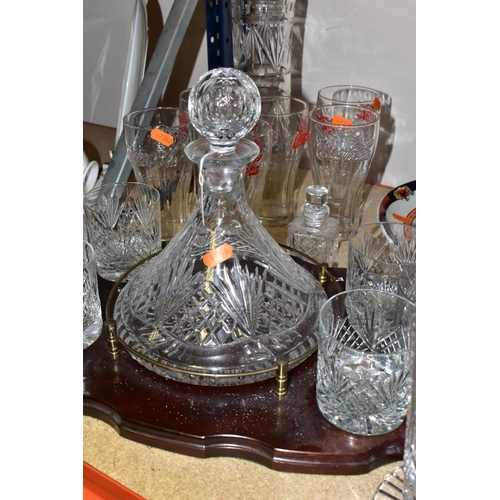 352 - A TUTBURY CRYSTAL SHIP'S DECANTER WITH SIX MATCHING WHISKY TUMBLERS SET ON A WOODEN SERVING TRAY, to... 