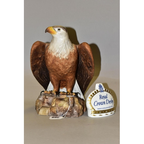 368 - A ROYAL CROWN DERBY EAGLE AND CROWN NAMESTAND, the matt glazed bald eagle modelled perched on a rock... 