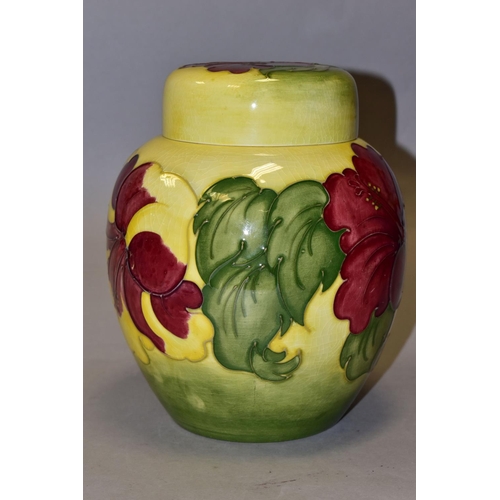 370 - A LARGE MOORCROFT POTTERY GINGER JAR AND COVER, 'Hibiscus' pattern on a graduated yellow green groun... 