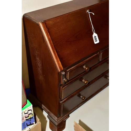 405 - A MINIATURE BUREAU, with stained finish, pull down front revealing internal drawers and compartments... 