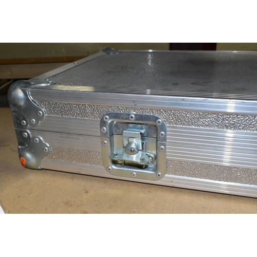 411 - A GUITAR FLIGHT CASE, in aluminium, having ball corners, shaped foam lining, and butterfly fastening... 